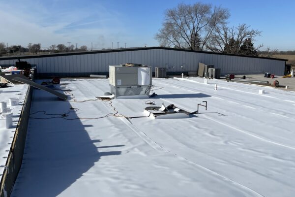 Oklahoma City roofing company team discussing roof installation