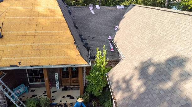 Roofing crew replacing storm-worn shingles on an occupied Lexington home during a planned daytime project