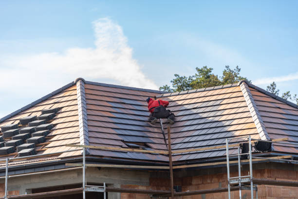 Skilled roofer inspecting flashing, ventilation, and shingle wear before recommending full roof replacement