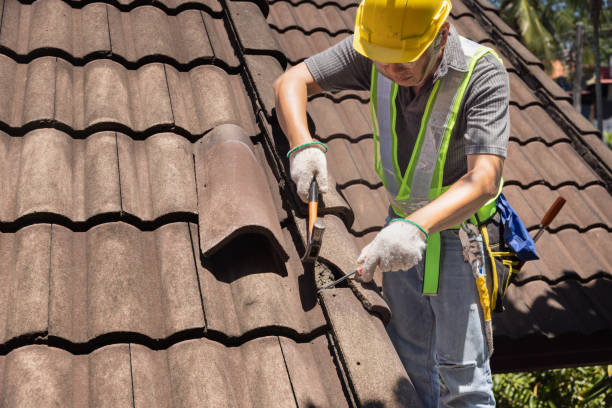 Crew replacing worn shingles on a family home in Noble after repeated storm-related roof leaks